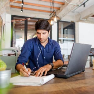 Young Man Taking Notes