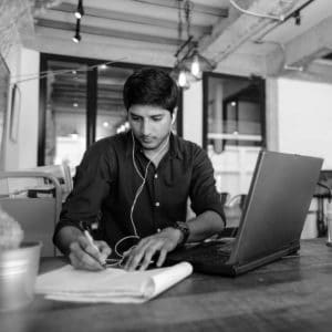 Young Man Taking Notes