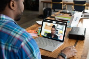 Remote interviews Man interviewing Woman Via Laptop