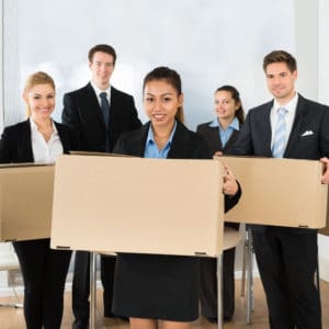 Portrait of Happy, Multiethnic Employees in Office Holding Cardboard Boxes