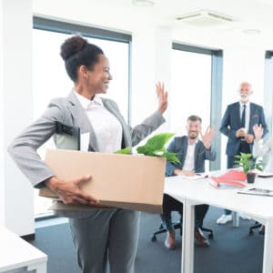 Woman Bids Goodbye to Her Colleagues