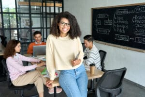 Benefits of Leadership Training Young, Happy, African, American, Woman, Team, Leader, Sitting on Desk